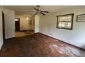 Spacious living room with hardwood floors, ceiling fan, and natural light at 2588 Sandtown Sw Rd, Marietta, GA 30060