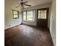 Cozy living room featuring a sunny bay window and hardwood floors at 2588 Sandtown Sw Rd, Marietta, GA 30060