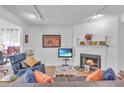Bright living room with a cozy fireplace and comfortable seating area at 301 Cobblestone Trl, Avondale Estates, GA 30002