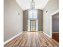 Spacious foyer with high ceilings, wood floors, and a decorative chandelier at 3272 Pinestream Nw Rd, Atlanta, GA 30327