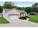 Exterior view of home with a long driveway and attached garage at 521 Peeples Valley Nw Rd, Cartersville, GA 30121