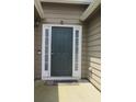 Close-up of a traditional front door with white trim and a welcome mat at 4517 Baker Grove Nw Rd, Acworth, GA 30101