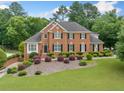 Stunning brick home with well-manicured lawn and landscaping for great curb appeal at 1360 Wilmington Way, Grayson, GA 30017