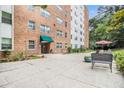 Apartment building with an outdoor patio and seating area at 2965 Pharr Nw Ct # 714, Atlanta, GA 30305