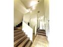 Bright entryway features wood stairs and tiled flooring, creating an inviting space at 210 Ormond Sw St, Atlanta, GA 30315