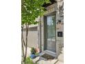 A close-up of a townhome's front door, framed by brick and neat landscaping at 215 Arizona Ne Ave # 3, Atlanta, GA 30307