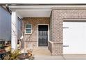 Close-up of the front door and brick exterior of the home at 4798 Red Lion Pl, Lawrenceville, GA 30044