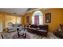 Spacious living room with vaulted ceiling, large window, and comfortable seating at 7101 Brecken Pl, Lithonia, GA 30058
