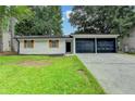 Charming single-story home with a well-maintained lawn and a two-car garage at 2508 Wagon Trce, Duluth, GA 30096