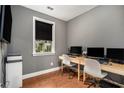 A well-lit office featuring a minimalist desk setup and window offering natural light at 2673 Caruso Way, Atlanta, GA 30339