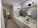 Luxurious bathroom with double vanity, soaking tub, and a separate glass-enclosed shower at 72 Hanover Dr, Villa Rica, GA 30180