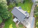 Birds-eye view of the home highlighting roof, the backyard, deck, patio, and driveway at 150 Kensley Way, Dallas, GA 30157