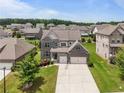 Attractive brick two-story home with a two-car garage in a well-kept suburban neighborhood at 4154 Hawking Dr, Suwanee, GA 30024