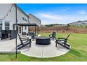 Well-maintained backyard featuring a cozy fire pit area and stylish outdoor furniture, perfect for entertaining at 87 Rushing View Gln, Dallas, GA 30157