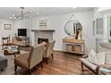 Cozy living room with hardwood floors, fireplace, and comfortable seating in a naturally-lit interior at 2316 Defoors Ferry Nw Rd, Atlanta, GA 30318