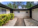 Close up of front entrance with white brick, a black door, and a walkway at 3068 Cherry Blossom Ln, Atlanta, GA 30344