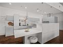 Stylish kitchen with sleek gray cabinetry, marble countertops, pendant lighting, and modern appliances at 845 Spring Nw St # Ph 5, Atlanta, GA 30308