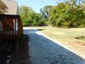 Spacious backyard with a concrete patio, perfect for outdoor activities and relaxation at 893 Andrews Dr, Conyers, GA 30012