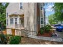 Well-kept townhouse with manicured landscaping and a charming entrance, offering a pleasant first impression at 4149 Spring Cove Dr, Duluth, GA 30097