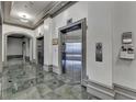 Condominium elevator with marble floors and detailed molding at 795 Hammond Dr # 1108, Atlanta, GA 30328