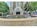 The Park Towers entrance complete with water feature and lush landscaping at 795 Hammond Dr # 1108, Atlanta, GA 30328