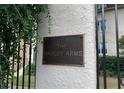 Close-up of the building nameplate affixed to a pillar on the right side of the entry gate at 1230 Piedmont Ne Ave # 405, Atlanta, GA 30309