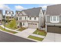 Exterior view of home showing driveway and landscaping in a suburban neighborhood at 1010 Fendley St, Woodstock, GA 30188