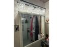 Modern bathroom mirror reflecting shower with black matte fixtures and tiled walls at 314 3Rd Ne St # 4, Atlanta, GA 30308