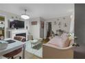 Cozy living room with fireplace, plush seating, area rug, and stylish decor accents at 314 3Rd Ne St # 4, Atlanta, GA 30308