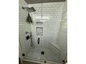 Elegant walk-in shower featuring white subway tile and rainfall showerhead at 314 3Rd Ne St # 4, Atlanta, GA 30308