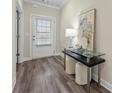 Welcoming entryway featuring stylish flooring and a decorative table with a glass top at 3735 Hazel Ave, Cumming, GA 30040