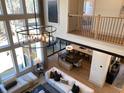 Open concept living room with soaring ceilings, modern light fixture, and contemporary furnishings at 3010 Florence St, Cumming, GA 30041