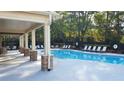 Resort style community pool featuring stone columns and lounge chairs at 2145 Coventry Dr, Brookhaven, GA 30319
