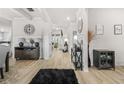 Elegant foyer with hardwood floors, decorative wall trim, and stylish furnishings at 361 Traditions Ln, Hampton, GA 30228