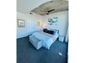 The bedroom features a ceiling fan, modern carpet, and natural lighting at 400 W Peachtree Nw St # 3412, Atlanta, GA 30308