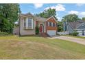 Charming two-story home with brick and siding, well-manicured lawn, and a two-car garage at 1010 San Marcos Cv, Lawrenceville, GA 30043