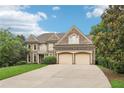 Lovely two-story brick home featuring an attached two-car garage and a concrete driveway at 4508 Meadow Vista Trce, Lithonia, GA 30038
