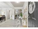 Grand foyer with decorative accents, elegant lighting and grey flooring at 140 Canyons Ct, Hampton, GA 30228