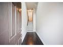 Inviting foyer featuring dark hardwood floors and a staircase leading to the upper level at 1505 Slopeside Loop, Smyrna, GA 30082