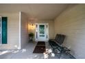 Cozy front porch with neutral siding and a charming spot to sit and relax at 5832 Sycamore Ridge Dr, Sugar Hill, GA 30518