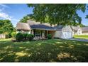 Charming single-Gathering home with attractive front porch and well-manicured lawn at 5832 Sycamore Ridge Dr, Sugar Hill, GA 30518