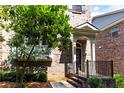 Charming brick townhome entrance with well-manicured landscaping at 4020 Townsend Ln, Atlanta, GA 30346