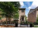 Brick townhome with charming architectural details and manicured landscaping at 4020 Townsend Ln, Atlanta, GA 30346