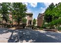 Brick townhome complex with well-maintained landscaping and street view at 4020 Townsend Ln, Atlanta, GA 30346