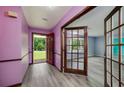 Welcoming entryway with sleek gray floors, and charming wood-framed glass doors at 35 Brookside Ct, Villa Rica, GA 30180