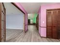Hallway with gray floors and doors leading to multiple rooms at 35 Brookside Ct, Villa Rica, GA 30180