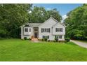 Beautiful two-story home featuring a well-maintained lawn and classic white siding at 4958 Alpine Ct, Winston, GA 30187