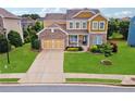 Beautiful two-story home featuring a well-manicured lawn, inviting curb appeal, and a spacious driveway at 506 Spring View Dr, Woodstock, GA 30188