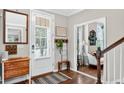 Inviting entryway features hardwood floors, decor, and seamless transition to the living spaces at 1223 Gathering Oaks Se Ct, Mableton, GA 30126