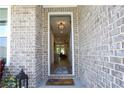 Inviting entryway featuring a welcome mat and clear view into the home's interior at 330 Carriage Glen Ln, Woodstock, GA 30188